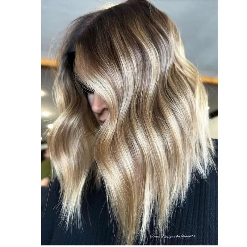 Soft balayage waves with a natural, melted root