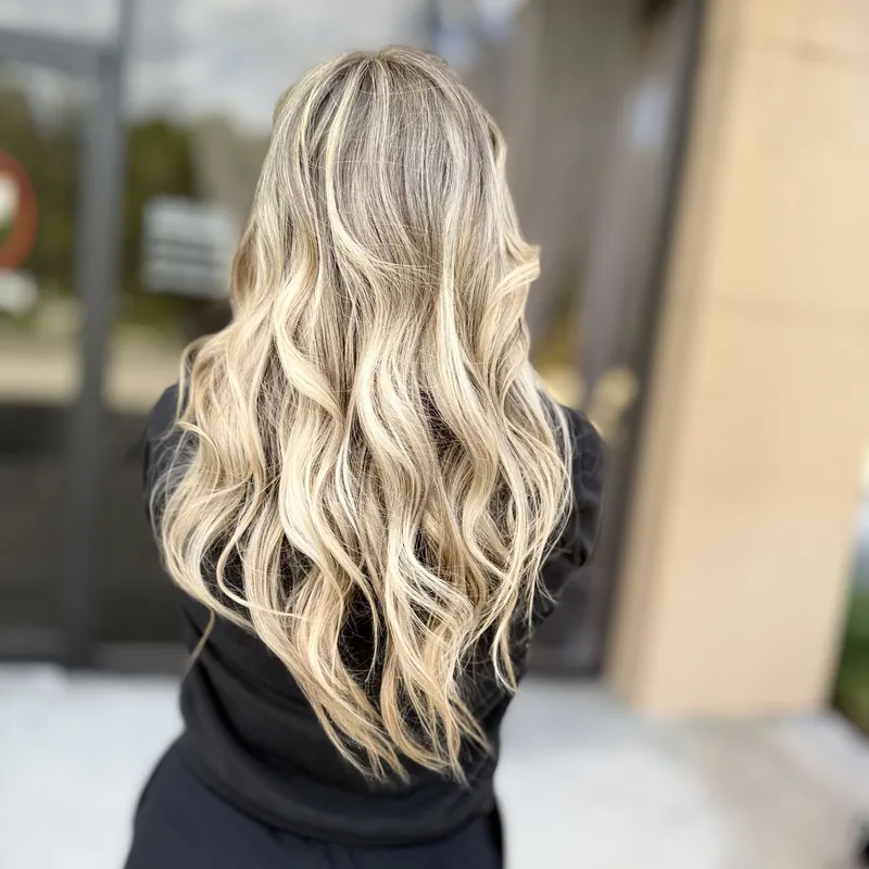 Blonde waves with a melted root